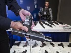 Peel Regional Police display guns seized during a drug trafficking investigation dubbed Project Baron on Tuesday, March 26, 2019. (Stan Behal/Toronto Sun/Postmedia Network)