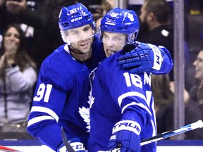 Toronto Maple Leafs right wing Mitchell Marner (16) celebrates his goal against the New York Rangers with center John Tavares (91) during third period NHL hockey action in Toronto on Saturday, December 22, 2018. THE CANADIAN PRESS/Frank Gunn ORG XMIT: FNG208