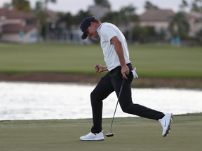 Keith Mitchell celebrates as he sinks his putt on the 18th hole to win the Honda Classic on Sunday. Mitchell’s last win was on a mini-Tour event in 2016.  AP