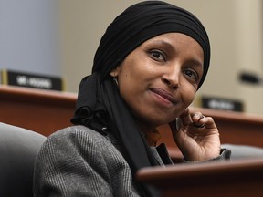 Rep. Ilhan Omar, D-Minn., listens as Office of Management and Budget Acting Director Russell Vought testifies before the House Budget Committee on Capitol Hill in Washington, Tuesday, March 12, 2019. (AP Photo/Susan Walsh)