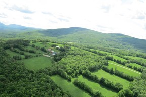 View from helicopter of lush cultivated fields and forest in White Mountains near Sugar Hill, N.H. (Ian Robertson)