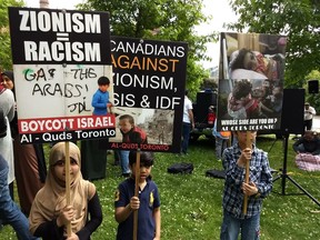 Signs displayed at the Toronto al-Quds day rally on Saturday, June 9 2018.