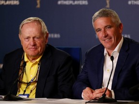 Golf legend Jack Nicklaus (left) and PGA Tour Commissioner Jay Monahan (right) speak to the media during a practice round for The Players Championship on The Stadium Course at TPC Sawgrass in Ponte Vedra Beach, Fla., on Wednesday, March 13, 2019.