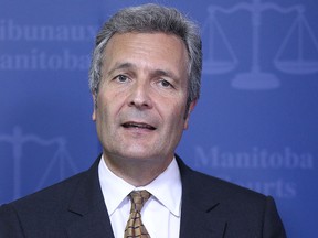 Glenn Joyal, chief justice of the court of Queen’s Bench, speaks during a press conference to discuss Access to Justice Initiatives at the Law Courts Building in Winnipeg on June 27, 2014.