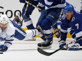 Mathieu Joseph (7) of the Tampa Bay Lightning draws a penalty for tripping Nazem Kadri of the Maple Leafs on Monday night at Scotiabank Arena. (Claus Andersen/Getty Images)