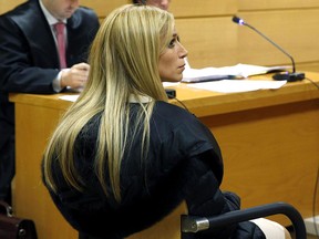 Aurea Vazquez Rijos of Puerto Rico, sits inside a court room at the National Court in Madrid, Wednesday Dec. 18, 2013. (AP Photo/Javier Lizon, Pool)