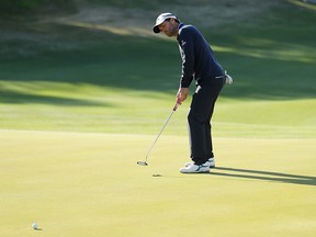 Kevin Kisner of the United States putts on the 16th green to defeat Matt Kuchar of the United States 3&2 during the final round of the World Golf Championships-Dell Technologies Match Play at Austin Country Club on March 31, 2019 in Austin, Texas.