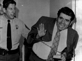 Serial killer Juan Corona mugs for the camera during his 1973 murder trial. He killed and dismembered 25 men. He died Monday.