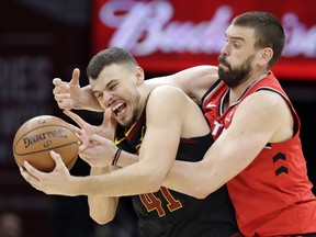 The Raptors' Marc Gasol (right) with the Cavaliers' Ante Zizic on Monday in Cleveland. (The Associated Press)