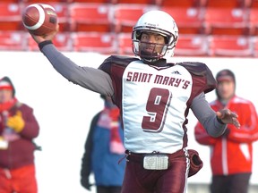 Micah Brown, quarterback for the Saint Mary's University Huskies throws a pass against the University Of Calgary Dinos in the 2010 Mitchell Bowl at McMahon Stadium in Calgary on Nov. 20, 2010