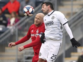 Toronto FC midfielder Michael Bradley (left) battles Philadelphia Union midfielder midfielder Ilsinho (right) for a header in the first half of an MLS match in Chester, Pa., Saturday, March 2, 2019.