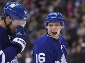 Maple Leafs' Mitch Marner (right) is closing in on 100 points for the season. (THE CANADIAN PRESS FILES)