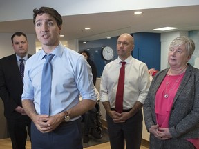 Prime Minister Justin Trudeau, accompanied by West Nova MP Colin Fraser, Halifax MP Andy Fillmore and South Shore-St. Margaret's MP Bernadette Jordan, minister of Rural Economic Development, left to right, addresses the media as he visits the Northwood seniors' residence in Halifax on Thursday, March 28, 2019. THE CANADIAN PRESS/Andrew Vaughan