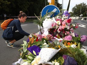 The floral tributes grow on Deans Avenue near the Al Noor Mosque as locals pay tribute to those who were killed in Christchurch, New Zealand, on Saturday, March 16, 2019.