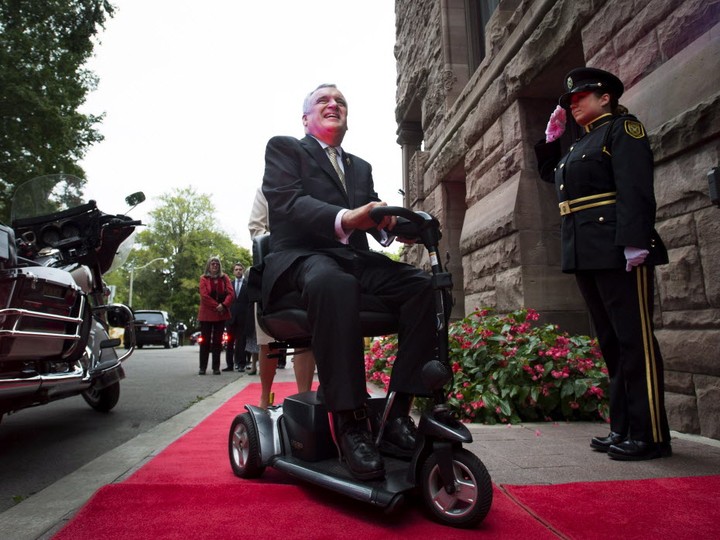  Former Ontario Lieutenant-Governor David Onley, who was tasked with reviewing the disability legislation and found the province is nowhere near meeting its stated goal of full accessibility by 2025, is saluted while arriving for his last full day in office at Queen’s Park on Monday, Sept. 22, 2014. (THE CANADIAN PRESS/Darren Calabrese)