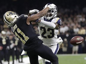 In this Jan. 20, 2019, file photo, Los Angeles Rams' Nickell Robey-Coleman breaks up a pass intended for New Orleans Saints' Tommylee Lewis during the NFC championship game in New Orleans. (AP Photo/Gerald Herbert, File)