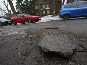 Beech Ave., in the Toronto Beaches neighbourhood, is pothole heaven. There are at least 17 large potholes in along a 30-metre stretch of road on Wednesday, March 13, 2019. (Jack Boland/Toronto Sun/Postmedia Network)