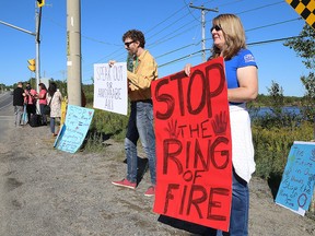 Alan Asher and Liz Carlson take part in a protest in Sudbury, Ont. against the development of the Ring of Fire on Thursday, September 6, 2018. (Postmedia file photo)