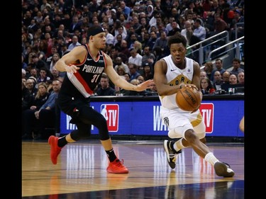 Toronto Raptors Kyle Lowry PG (7) deals the ball off past Portland Trail Blazers Seth Curry SG (31) In the first half in Toronto, Ont. on Friday March 1, 2019. Jack Boland/Toronto Sun/Postmedia Network