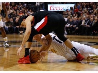 Toronto Raptors Jeremy Lin PG (17) fights for the ball with Portland Trail Blazers Seth Curry SG (31) In the first half in Toronto, Ont. on Friday March 1, 2019. Jack Boland/Toronto Sun/Postmedia Network