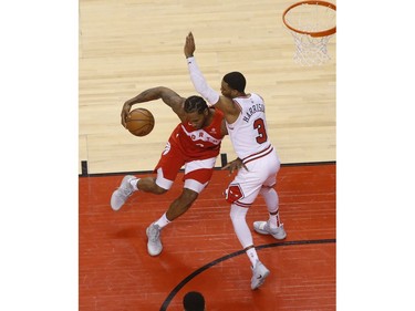 Toronto Raptors Kawhi Leonard SF (2) pushes through on Chicago Bulls Shaquille Harrison PG (3) during the second quarter in Toronto, Ont. on Wednesday March 27, 2019. Jack Boland/Toronto Sun/Postmedia Network