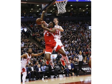 Toronto Raptors OG Anunoby SF (3) is fouled by Chicago Bulls Ryan Arcidiacono PG (51) during the second half in Toronto, Ont. on Wednesday March 27, 2019. Jack Boland/Toronto Sun/Postmedia Network