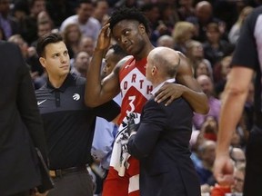 Toronto Raptors OG Anunoby SF (3) is in pain after a collision and went for concussion protocol during the second half in Toronto, Ont. on Tuesday March 26, 2019. Jack Boland/Toronto Sun/Postmedia Network