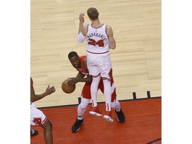 Toronto Raptors Serge Ibaka C (9) looks around a blocking Chicago Bulls Lauri Markkanen PF (24) during the second quarter in Toronto, Ont. on Wednesday March 27, 2019. Jack Boland/Toronto Sun/Postmedia Network