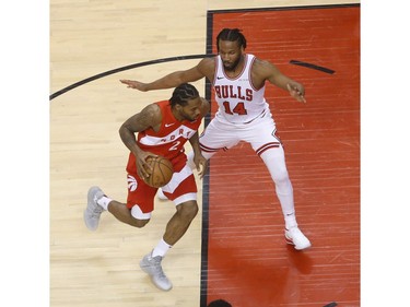 Toronto Raptors Kawhi Leonard SF (2) drives to the net past Chicago Bulls Wayne Selden SG (14) during the second quarter in Toronto, Ont. on Wednesday March 27, 2019. Jack Boland/Toronto Sun/Postmedia Network