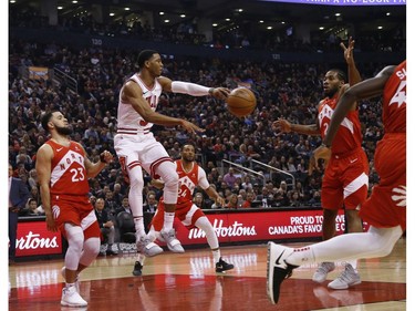 Chicago Bulls Shaquille Harrison PG (3) tries to dish the ball past Toronto Raptors Kawhi Leonard SF (2) during the first quarter in Toronto, Ont. on Tuesday March 26, 2019. Jack Boland/Toronto Sun/Postmedia Network