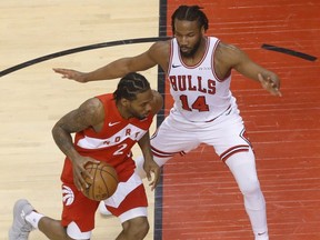 Raptors Kawhi Leonard  drives to the net past Chicago Bulls' Wayne Selden during the second quarter on Tueday night. Jack Boland/Toronto Sun/Postmedia Network