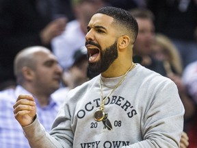 Rapper Drake cheers on the Toronto Raptors during 2nd half action against the Washington Wizards in Game 2 of the Eastern Conference - First Round at the Air Canada Centre in Toronto, Ont. on Tuesday April 17, 2018. Ernest Doroszuk/Toronto Sun/Postmedia Network
