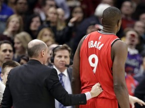 Toronto Raptors' Serge Ibaka (9), from Republic of Congo, is escorted off the court after getting ejected in the second half of an NBA basketball game against the Cleveland Cavaliers, Monday, March 11, 2019, in Cleveland. The Cavaliers won 126-101. (AP Photo/Tony Dejak)