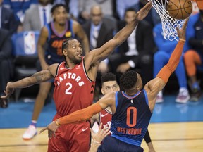 Oklahoma City Thunder guard Russell Westbrook (0) shoots as Toronto Raptors forward Kawhi Leonard (2) reaches out to block the shot during the first half of an NBA basketball game Wednesday, March 20, 2019, in Oklahoma City. AP Photo