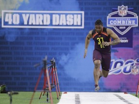 Michigan defensive lineman Rashan Gary runs the 40-yard dash during the NFL scouting combine in Indianapolis, Sunday, March 3, 2019.