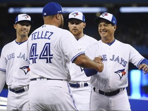 Blue Jays Rowdy Tellez (left) is greeted by manager Charlie Montoyo prior to the game on Thursday. THE CANADIAN PRESS