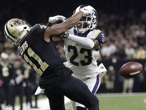 In this Jan. 20, 2019, file photo, Los Angeles Rams' Nickell Robey-Coleman breaks up a pass intended for New Orleans Saints' Tommylee Lewis during the second half of the NFL football NFC championship game in New Orleans. Reviewing penalty calls, including pass interference, will be among proposals NFL owners will hear to expand the use of replay when they meet next week in Phoenix. Expanding replay has become a scorching topic since the NFC championship game, when a non-call on a blatant pass interference and helmet-to-helmet hit by Rams defensive back Nickell Robey-Coleman likely cost the Saints a trip to the Super Bowl.