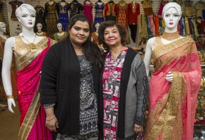 Bhupinder Jandoo, owner (right) and Iman Ahmad, who goes by Ayesha Sadiqa, a salesperson at Sonu Saree Palace along the Gerrard India Bazaar along Gerrard St. E. in Toronto, Ont. on Thursday, Feb. 28, 2019. (Ernest Doroszuk/Toronto Sun/Postmedia)