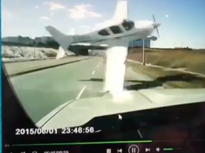 A plane narrowly misses a vehicle on 16th Ave. in Markham next to Buttonville airport on March 12, 2019. (Screengrab)