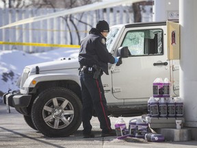 Toronto Police investigate a shooting that left a man in critical condition at a Petro-Canada gas station at Avenue Rd. and Eglinton Ave. W. on Friday March 8, 2019. A gun was recovered from inside the white Jeep with shattered windows, and blood appears to be on the driver's side exterior. (Ernest Doroszuk/Toronto Sun/Postmedia)