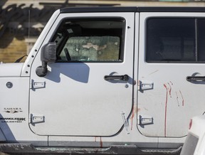 Toronto Police investigate a shooting that left a man in critical condition at a Petro-Canada gas station at Avenue Rd. and Eglinton Ave. W. on Friday March 8, 2019. A gun was recovered from inside the white Jeep with shattered windows, and blood appears to be on the driver’s side exterior. (Ernest Doroszuk/Toronto Sun/Postmedia)