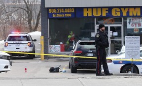 Peel Regional Police investigate the scene after a man was shot dead in a daylight shooting near Dundas and Cawthra in Mississauga on Monday March 11, 2019. Dave Abel/Toronto Sun