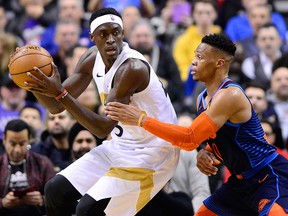Toronto Raptors forward Pascal Siakam controls the ball as Oklahoma City Thunder guard Russell Westbrook (0) defends during second half NBA basketball action in Toronto on Friday, March 22, 2019.