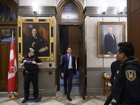 Prime Minister Justin Trudeau leaves the Foyer of the House of Commons for the evening after participating in the second night of a marathon voting session on Parliament Hill in Ottawa on Thursday, March 21, 2019.