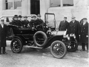 Col. Sam McLaughlin and a few of his senior executives pose for the photographer in front of General Motors of Canada’s headquarters building on William St. in Oshawa. The Colonel sits behind the steering wheel of a 1908 McLaughlin Model F typical of the Canadian company’s first “horseless carriage.” (Oshawa Public Library)