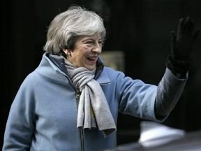 Britain's Prime Minister Theresa May waves as she leaves 10 Downing street in London, Thursday, March 14, 2019.