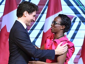 Prime Minister Justin Trudeau is welcomed by Parliamentary Secretary to the Minister of International Development Celina Caesar-Chavannes during a Black History Month reception at the Museum of History in Gatineau, Que., on Monday, Feb. 12, 2018.