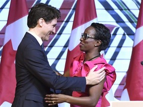 Prime Minister Justin Trudeau is welcomed by former Liberal MP Celina Caesar-Chavannes at a  reception at the Museum of History in Gatineau, Que., on Monday, Feb. 12, 2018.