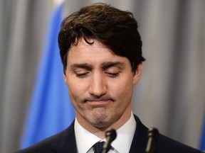 Prime Minister Justin Trudeau pauses after delivering an official apology to Inuit for the federal government's management of tuberculosis in the Arctic from the 1940s to the 1960s during an event in Iqaluit, Nunavut on Friday, March 8, 2019. THE CANADIAN PRESS/Sean Kilpatrick ORG XMIT: SKP509