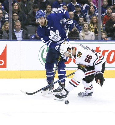 Toronto Maple Leafs right wing William Nylander (29)and Chicago Blackhawks defenseman Erik Gustafsson (56) on Wednesday March 13, 2019. The Toronto Maple Leafs host the Chicago Blackhawks at the Scotiabank Arena in Toronto. Veronica Henri/Toronto Sun/Postmedia Network